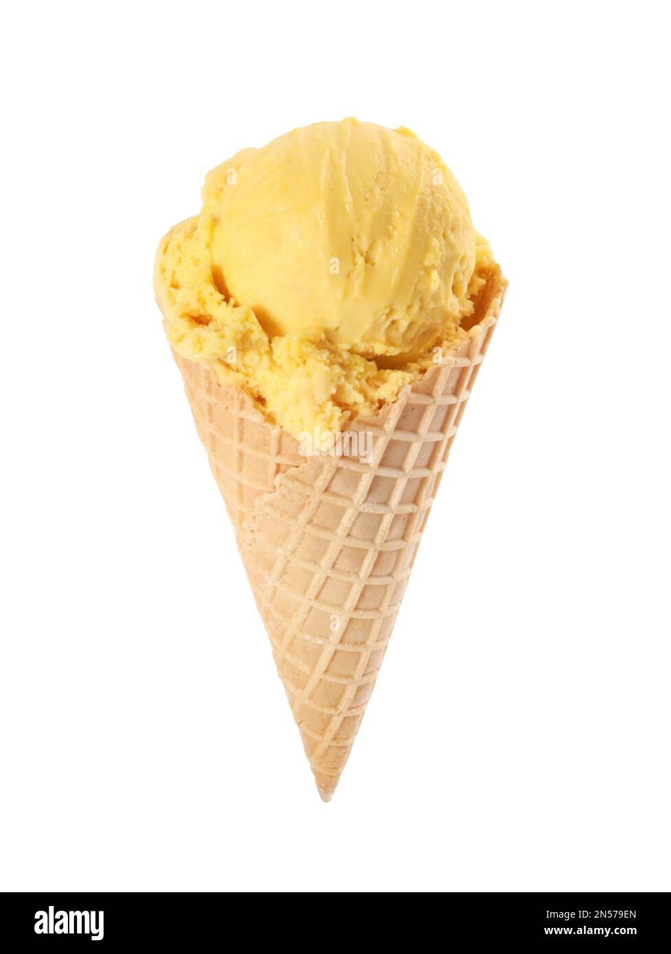 Delicious yellow ice cream in waffle cone isolated on white Stock Photo