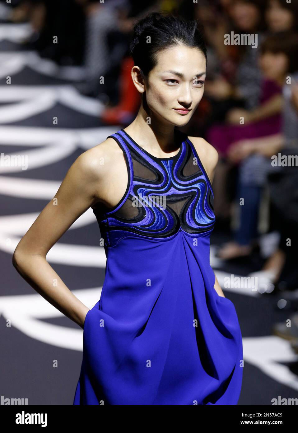 Japanese supermodel Ai Tominaga displays a creation by designer