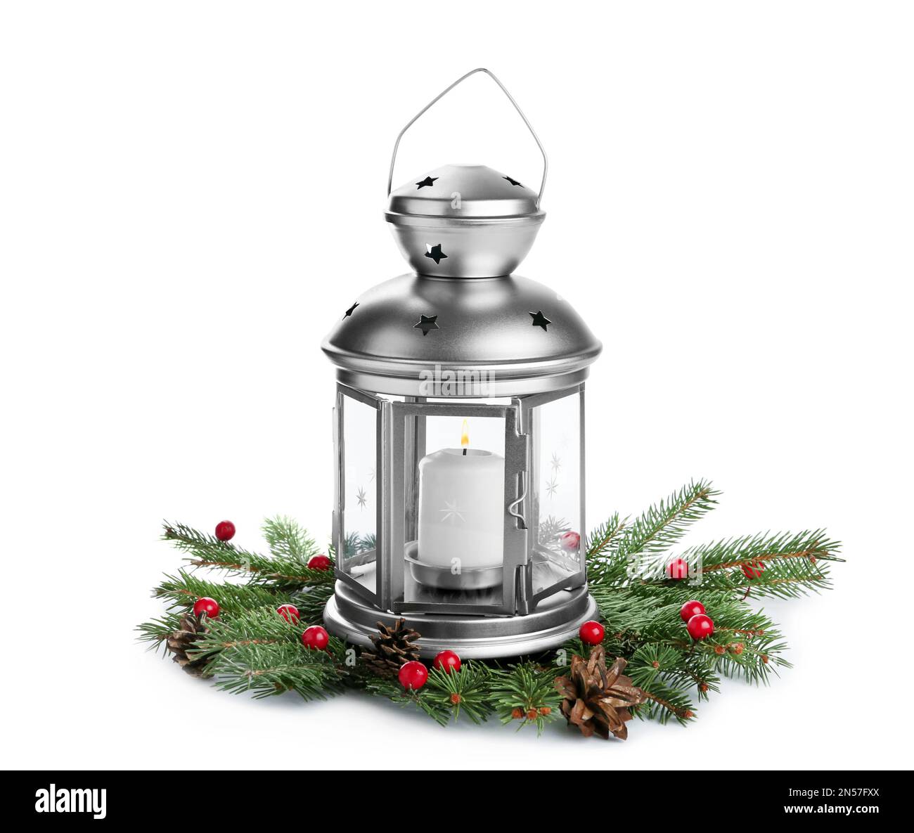Decorative Christmas lantern and coniferous twigs on white background Stock Photo