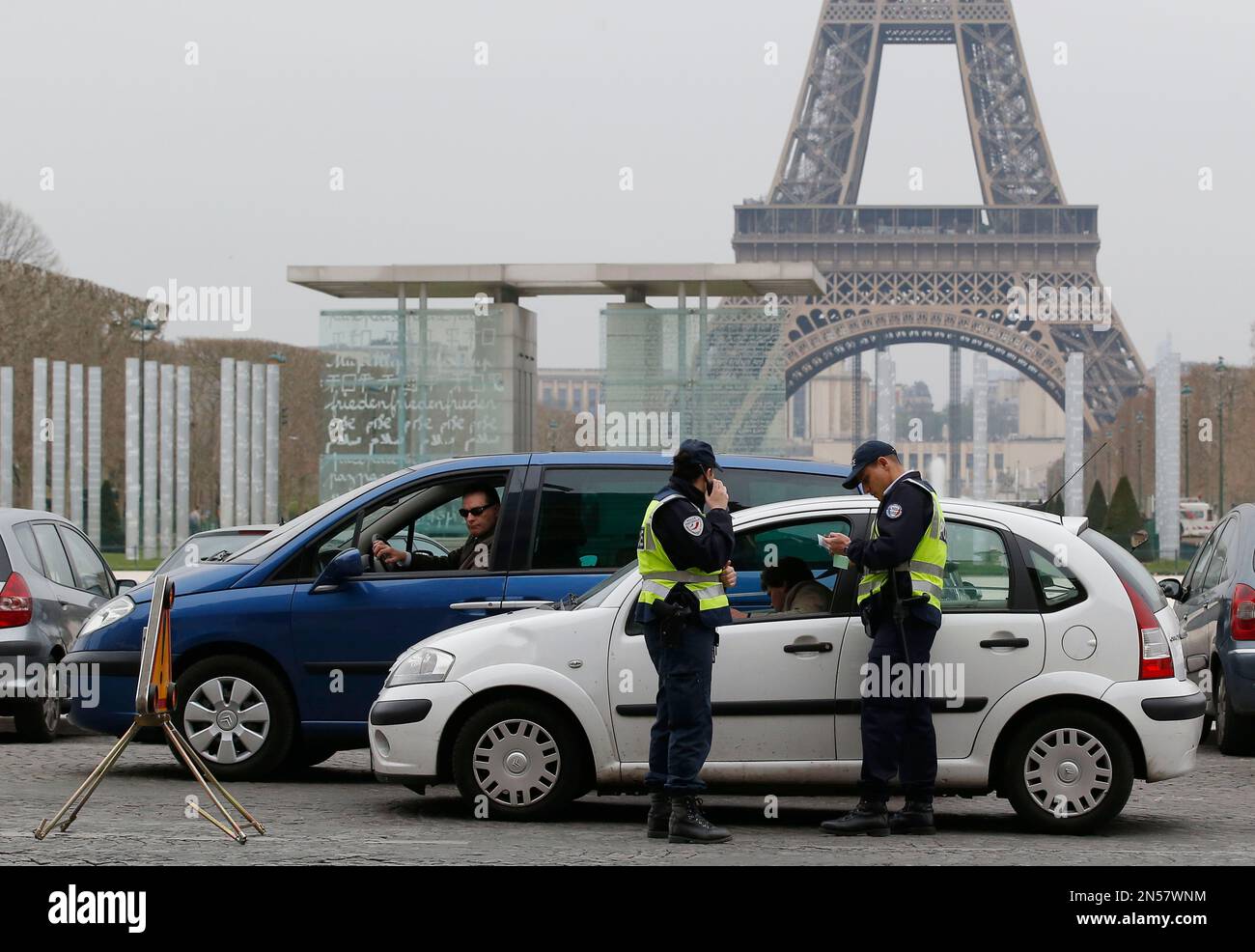 Police officers control vehicles near the Eiffel Tower in Paris, Monday