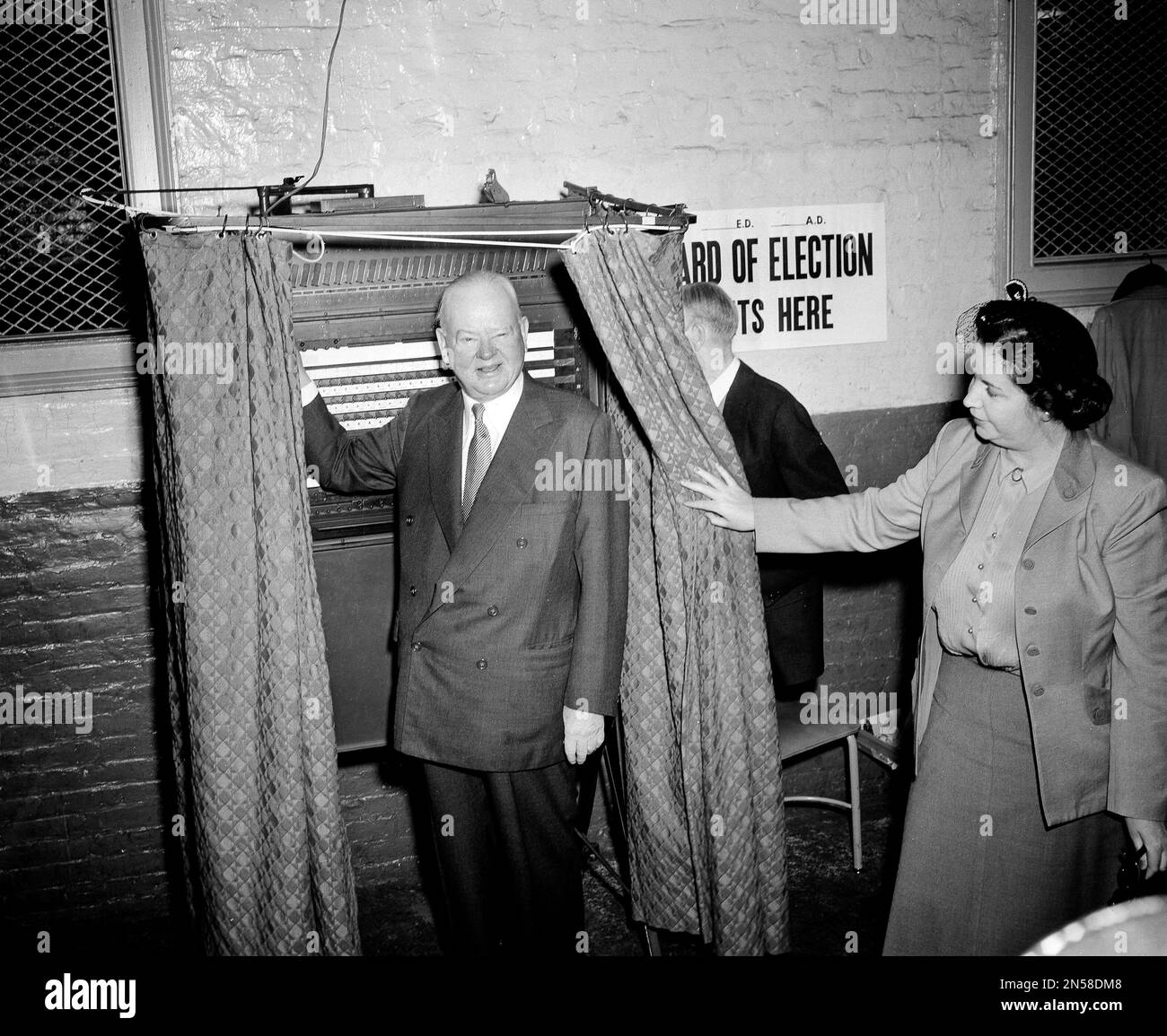 Former President Herbert Hoover smiles after voting in the New York