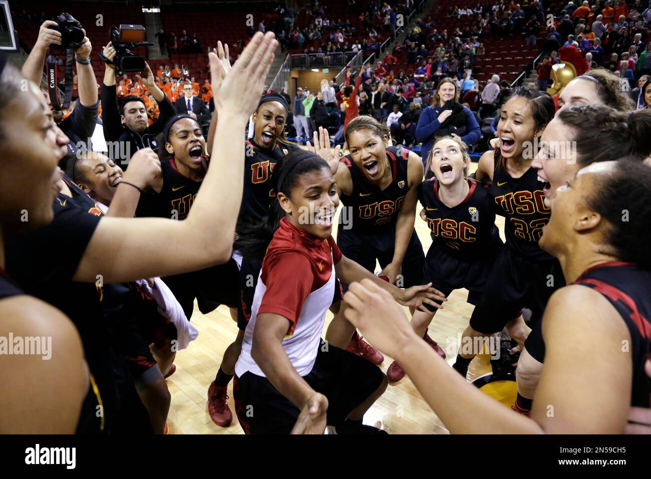 Southern California players huddle together in celebration after
