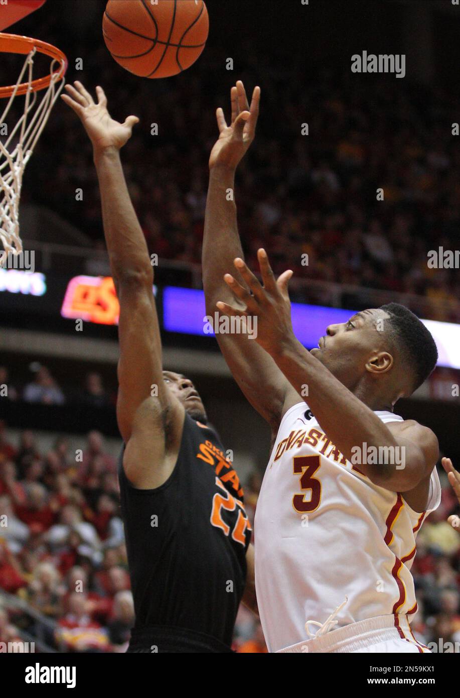 Iowa State forward Melvin Ejim, right, shoots over Oklahoma State guard