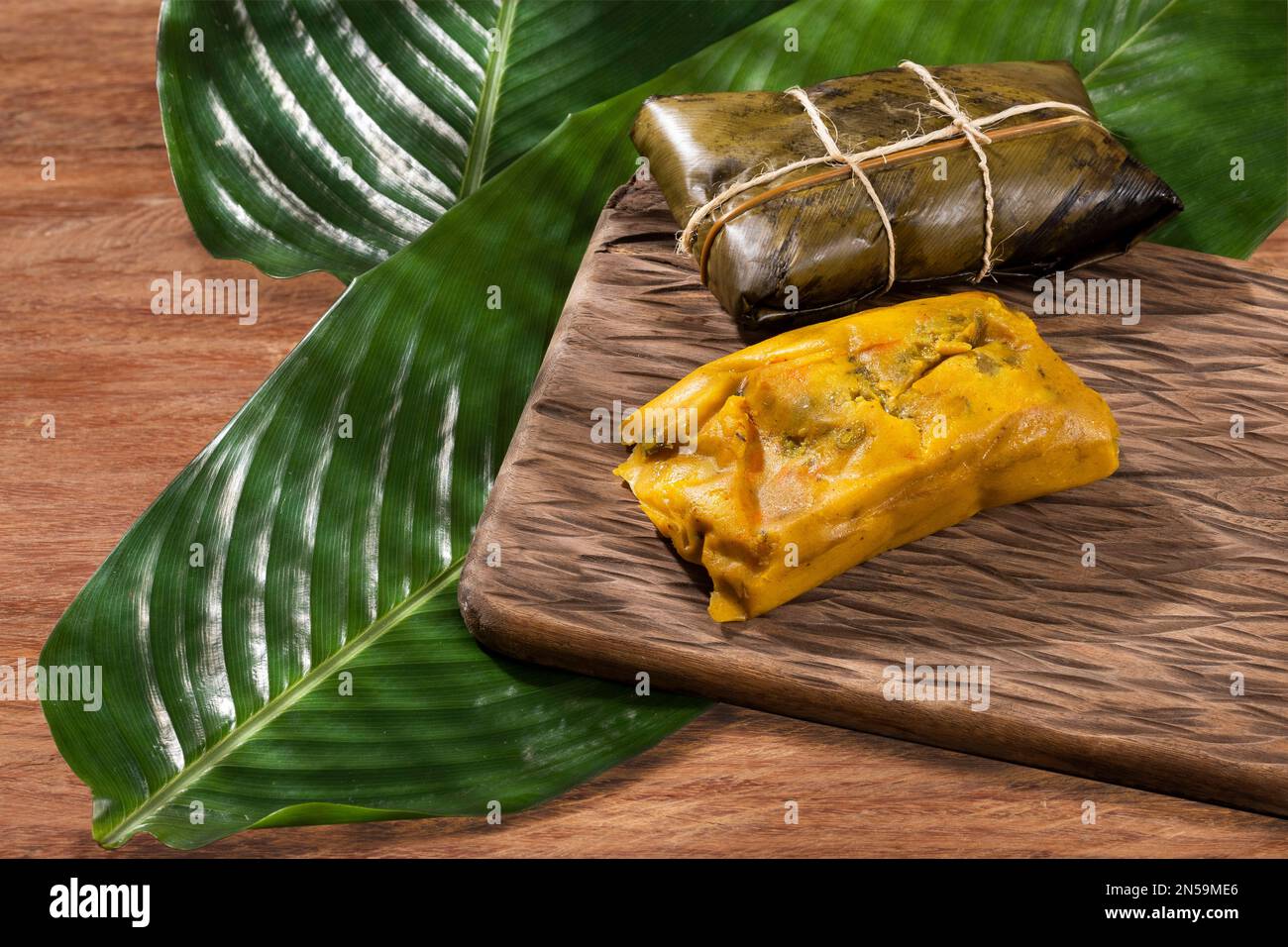 Tamale Typical Colombian Food Wrapped In Banana Leaves Stock Photo Alamy