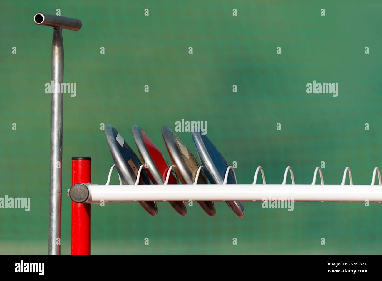 Athletics throw the discus, prepare the discus in the rack Stock Photo