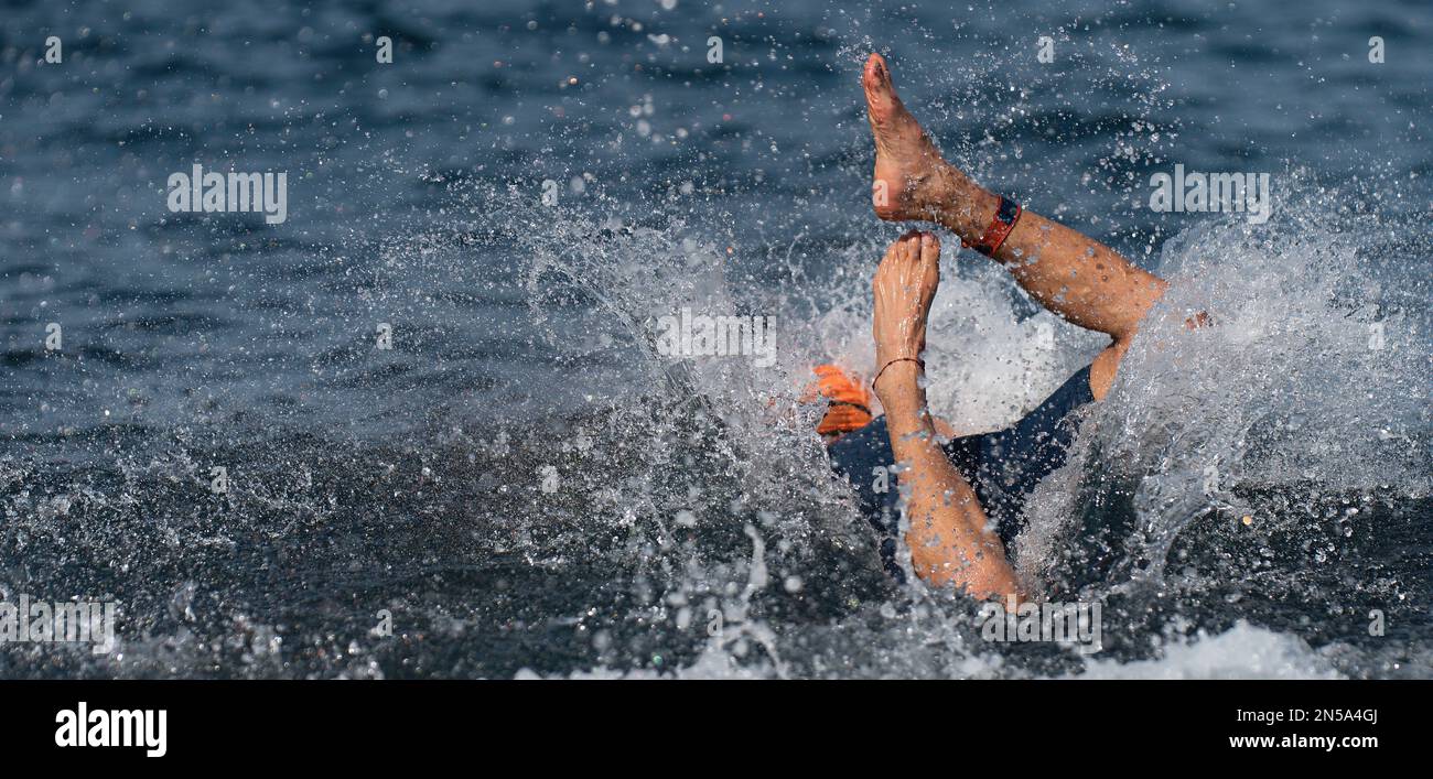 Swimmer at the start, jump flight into the ocean Stock Photo - Alamy