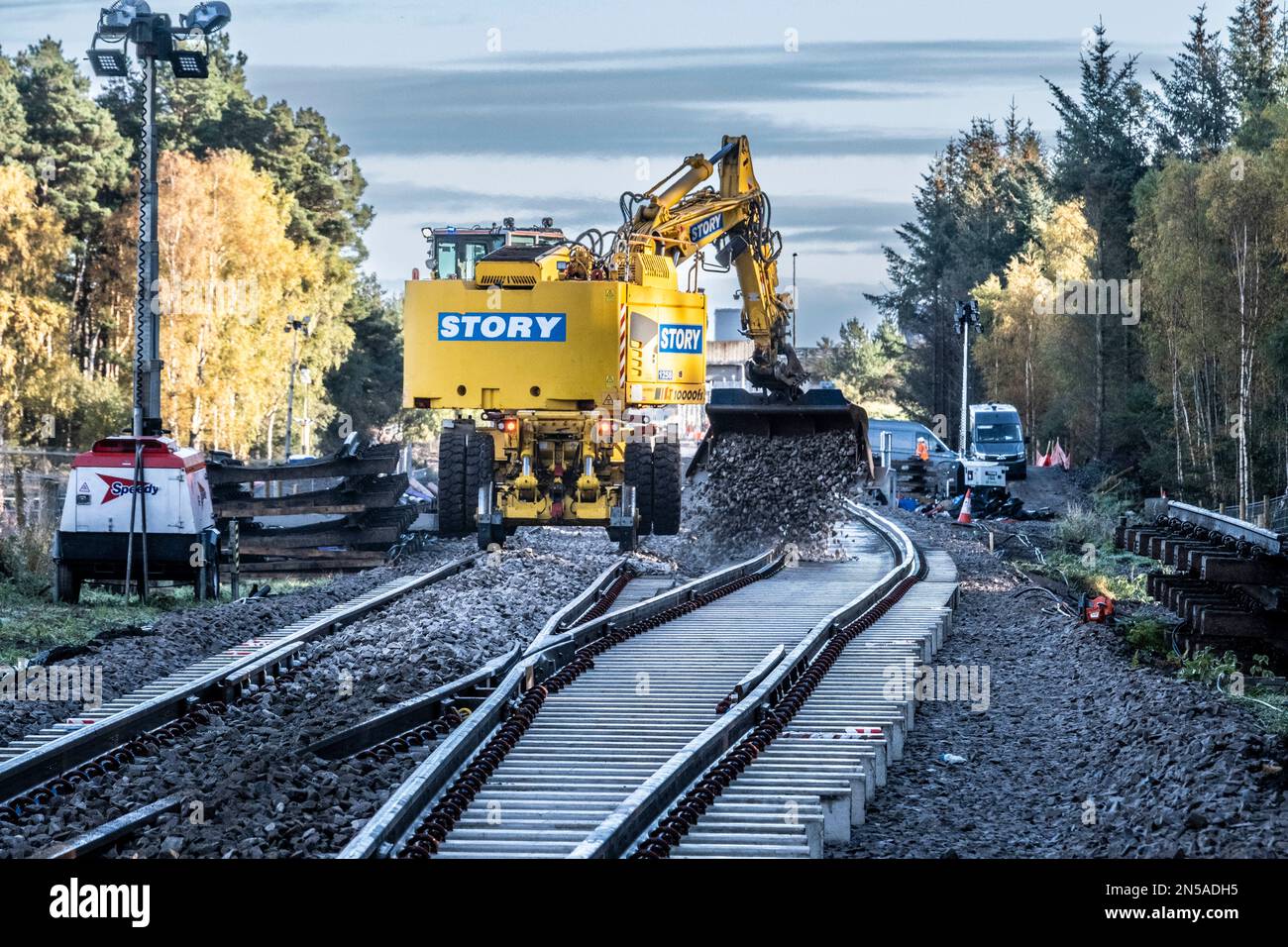 Railway workers building new railway and knocking down bridges Stock Photo