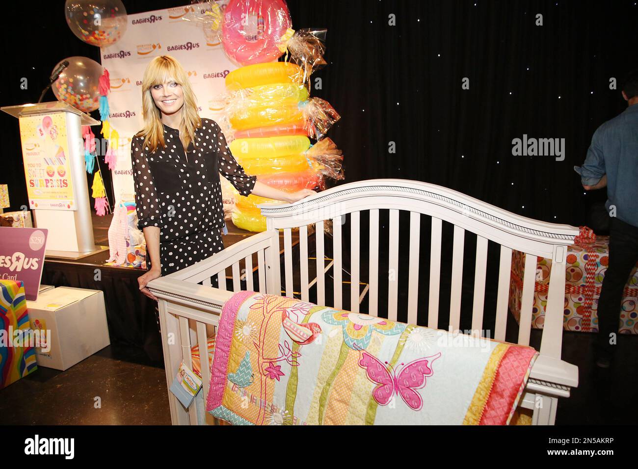 Heidi Klum poses at a baby shower for military momstobe by Heidi Klum
