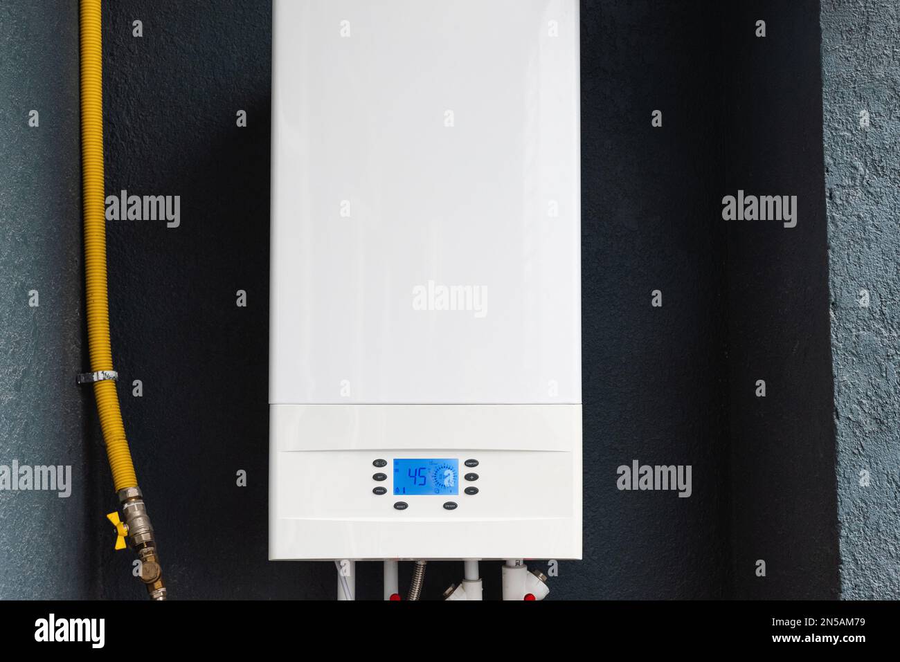 Doublecircuit gas boiler for winter home heating and water heating installed on the balcony of