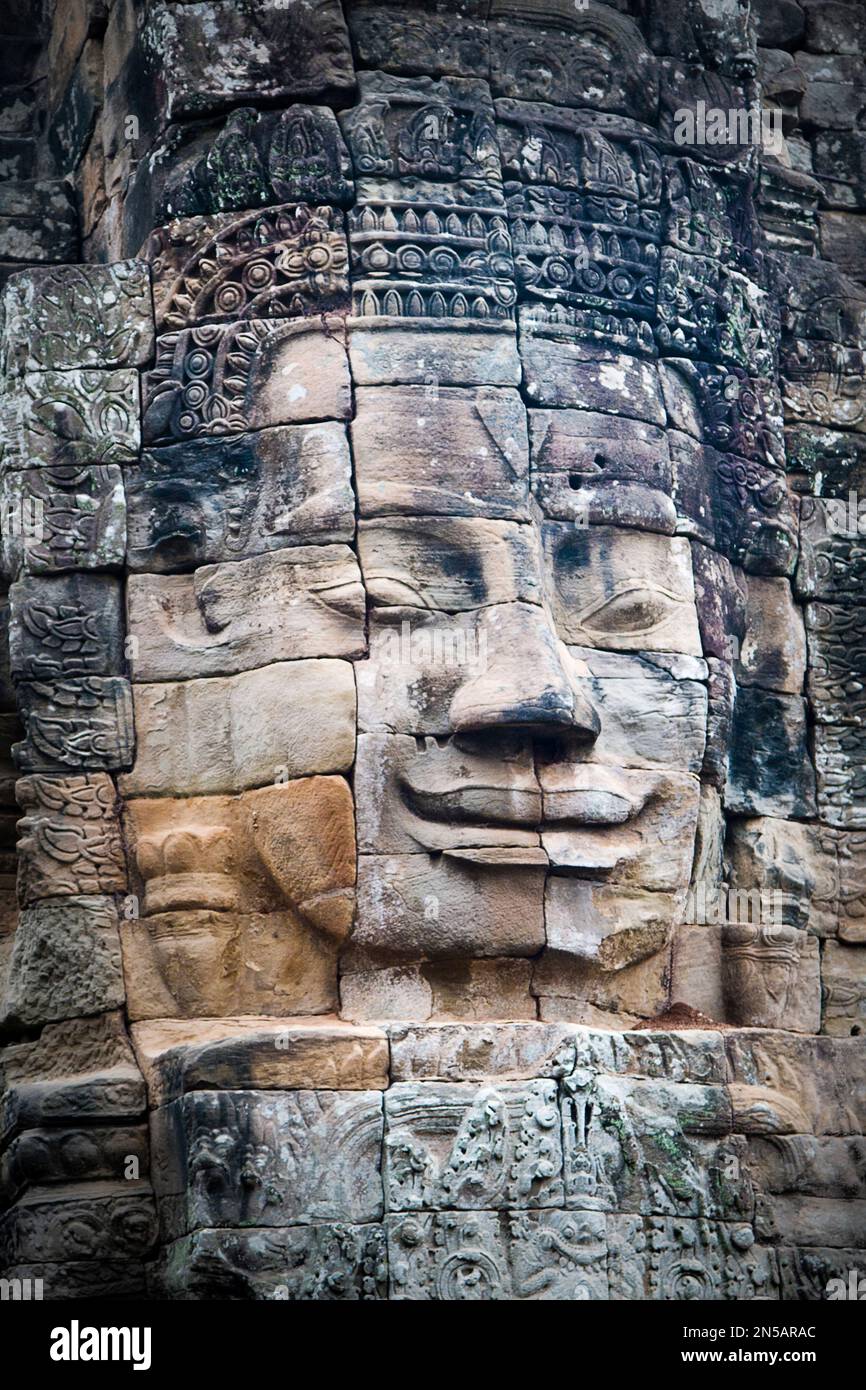 Giant stone faces  at Bayon Temple, Angkor Thom, Siem Reap, Cambodia Stock Photo
