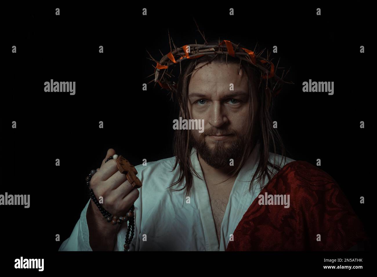 Jesus Christ wearing a crown of thorns and white chiton toga mantle ...