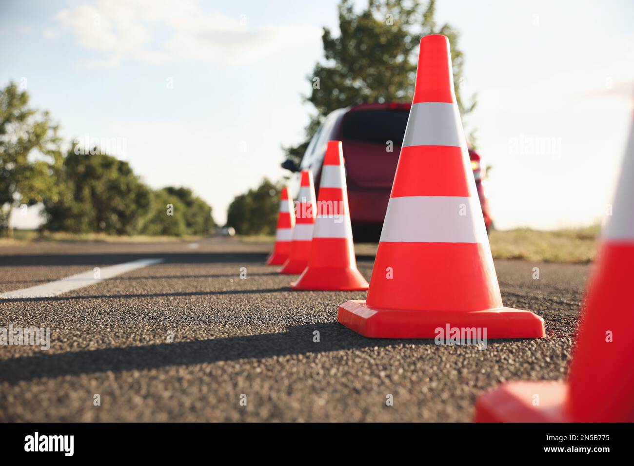 Traffic cones near car outdoors. Driving school exam Stock Photo Alamy