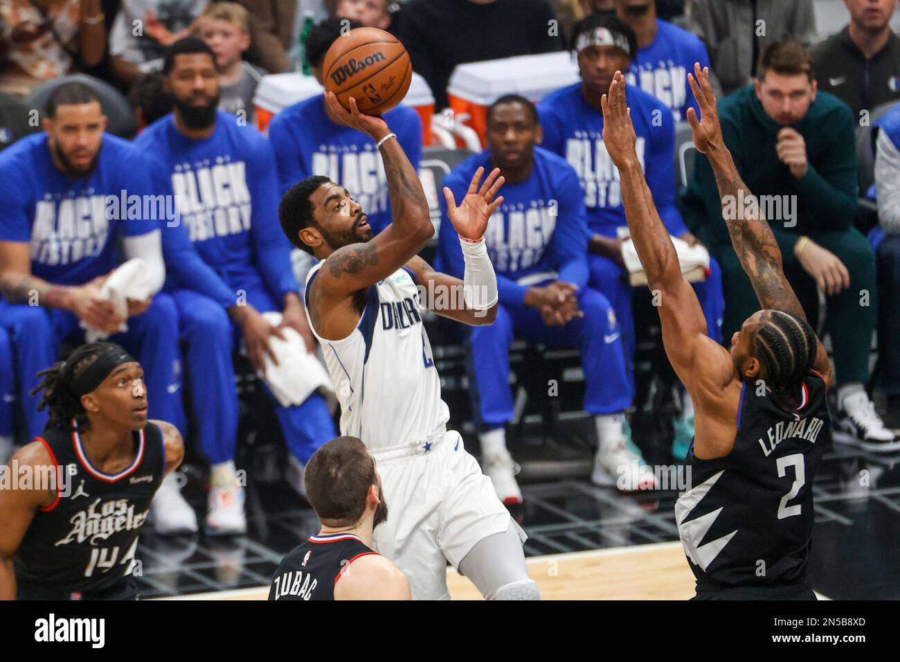 Kyrie Irving C of Dallas Mavericks and Kawhi Leonard R of Los Angeles Clippers in action during the NBA basketball game between Clippers and Mavericks at Crypto Arena. Final score Clippers 104 110