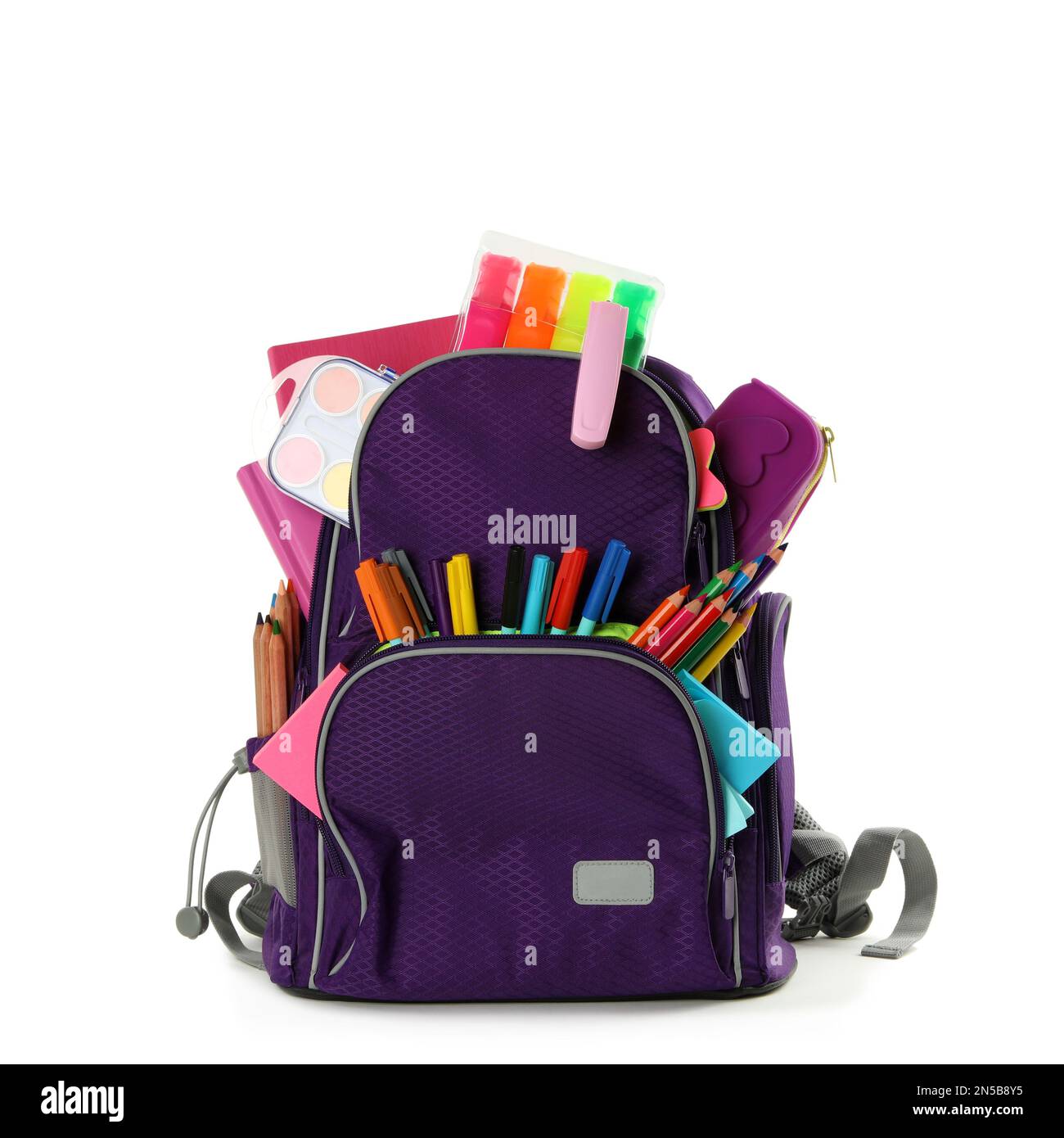 Purple backpack with different school stationery on white background Stock Photo