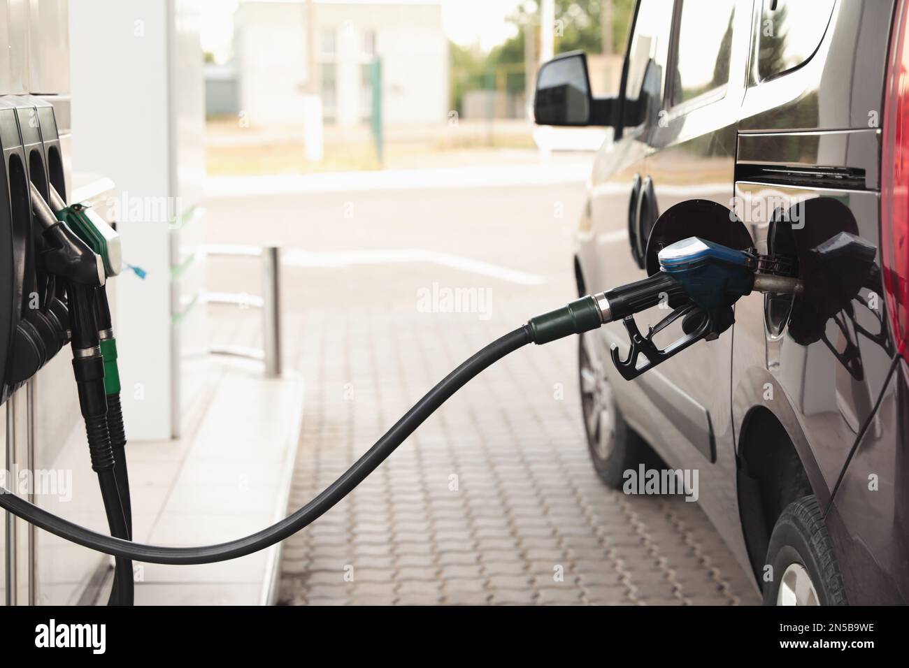 Refueling modern car at gas filling station, closeup Stock Photo - Alamy