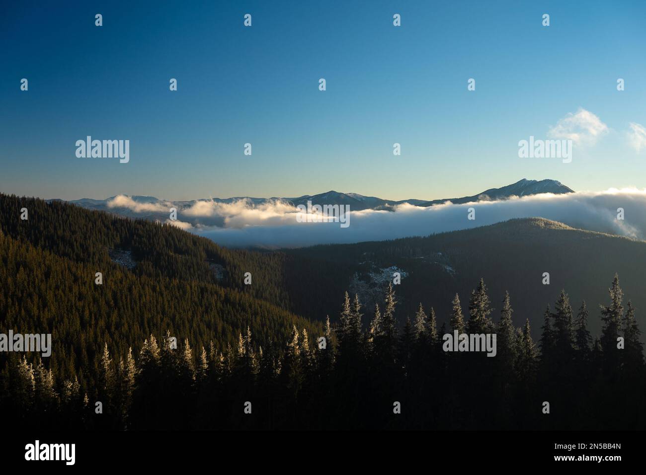 Rarau Mountains in Bucovina region of Romania. Warm January view from top of Rarau Pass Stock Photo