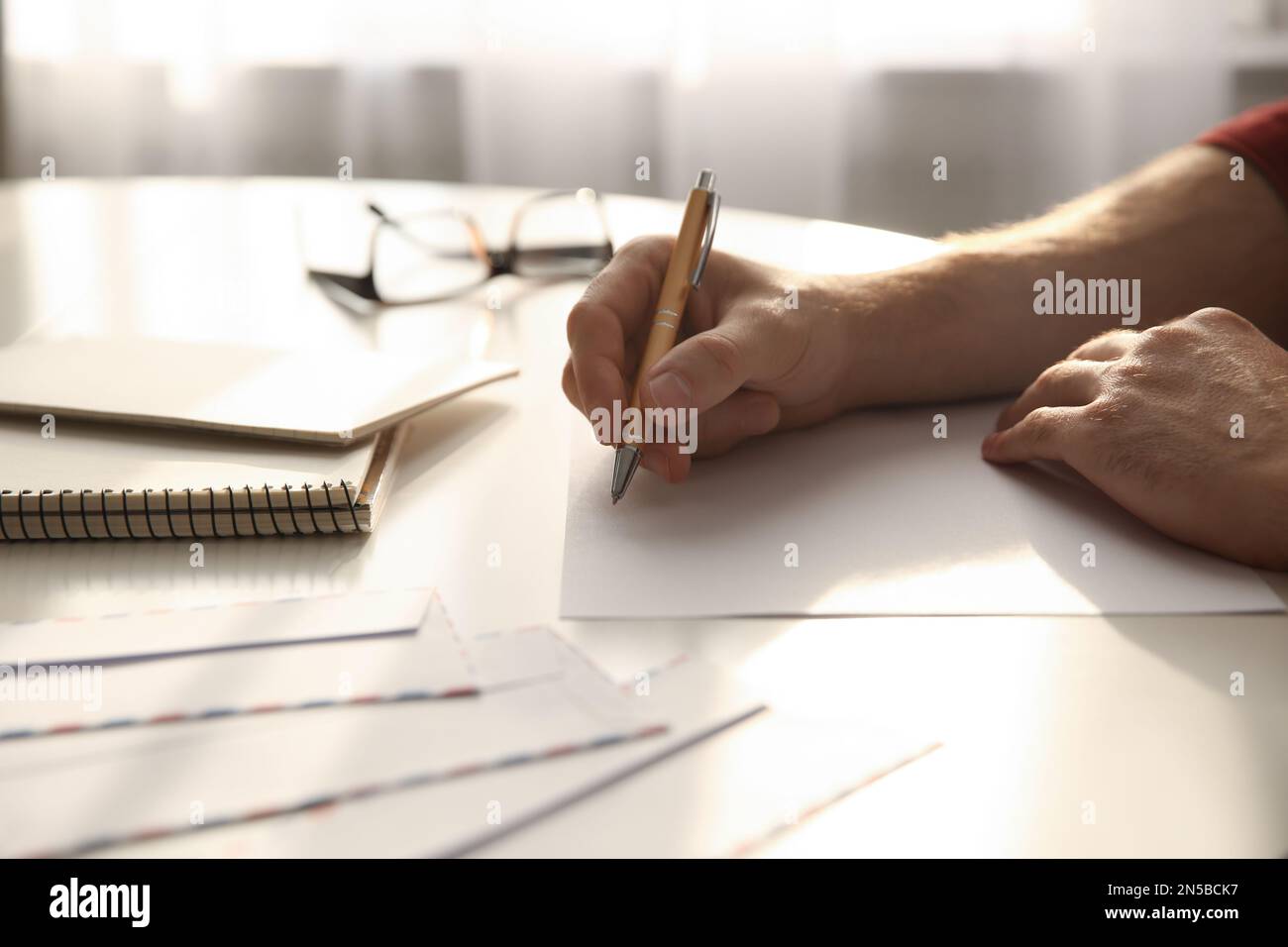 Simple beautiful man writing hi-res stock photography and images - Alamy