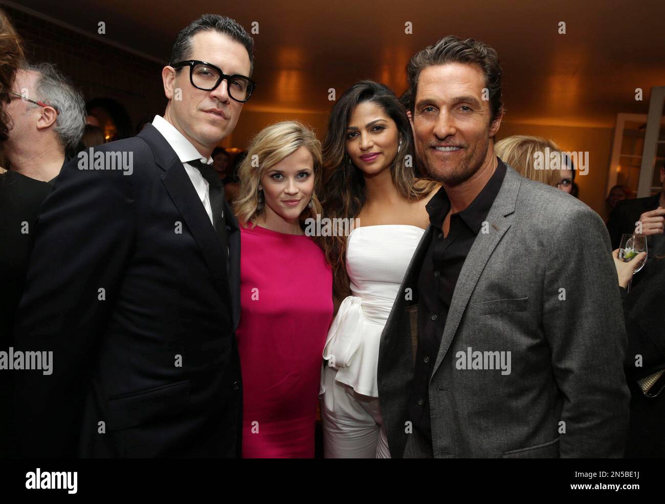 IMAGE DISTRIBUTED FOR FOCUS FEATURES - CAA's Jim Toth, Reese Witherspoon, Camila Alves and Matthew McConaughey attend the Focus Features and MAC Viva Glam celebration of Dallas Buyers Club, on Saturday, March 1, 2014 in Los Angeles. (Photo by Eric Charbonneau/Invision for Focus Features/AP Images) Stock Photo