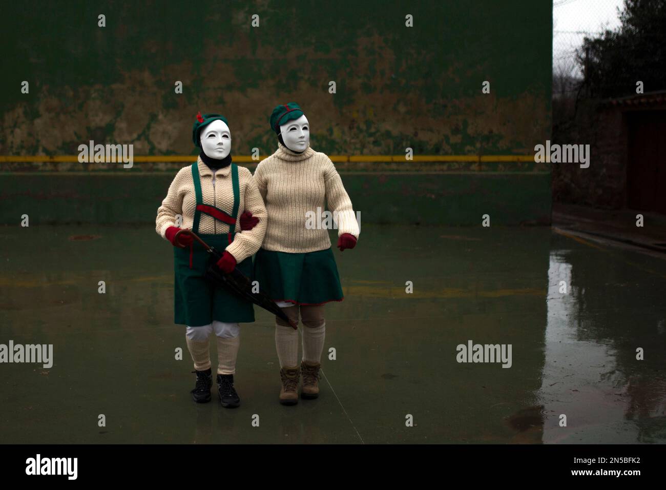 People Wearing Masks Walk Around A Square To Participate In A people-wearing-masks-walk-around-a-square-to-participate-in-a