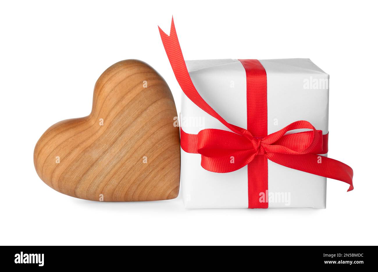 Beautiful gift box and toy heart on white background. Valentine's day celebration Stock Photo