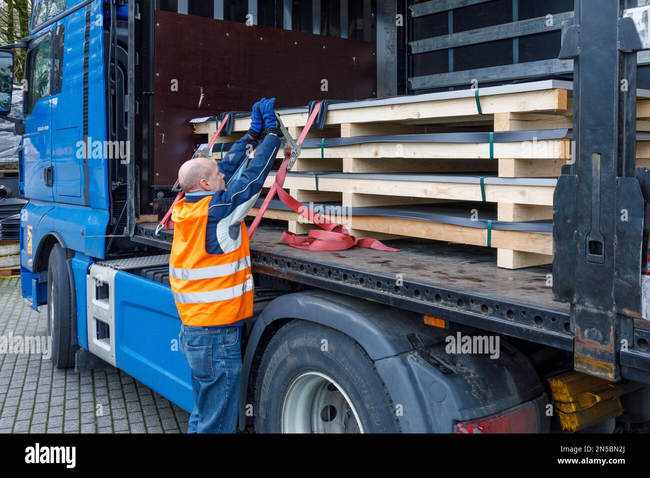 Freight transport, professional drivers in the loading zone, loading