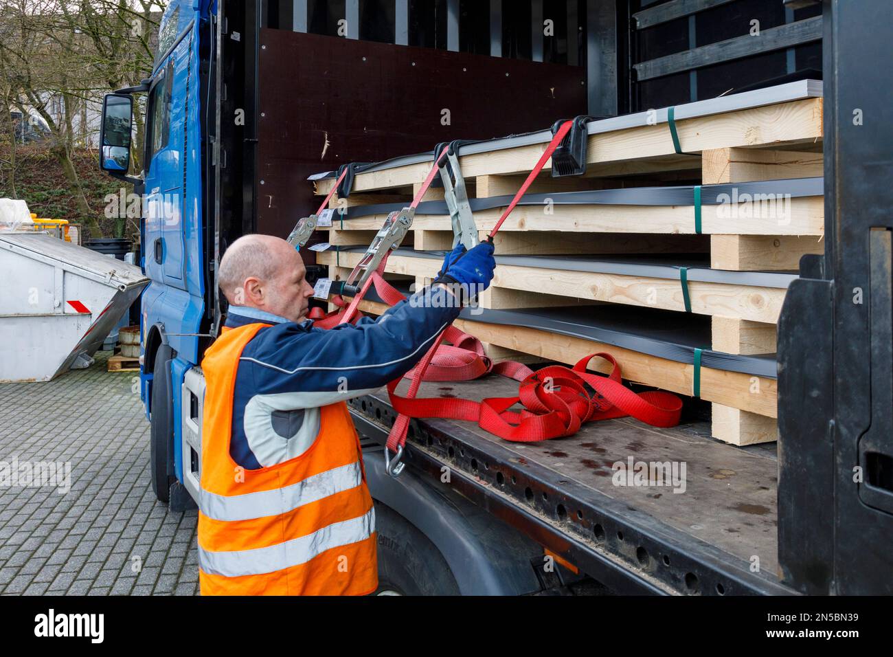 Freight transport, professional drivers in the loading zone, loading