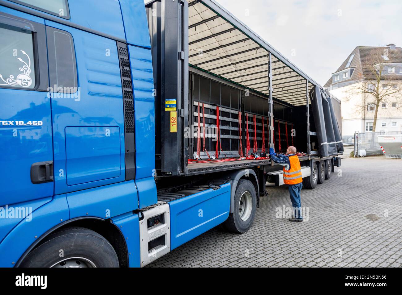Freight transport, professional drivers in the loading zone, loading