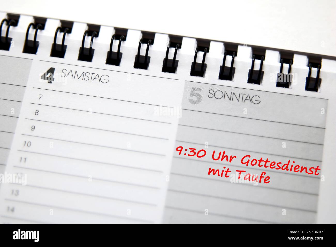 desk calendar in German with entry mass with baptism Stock Photo