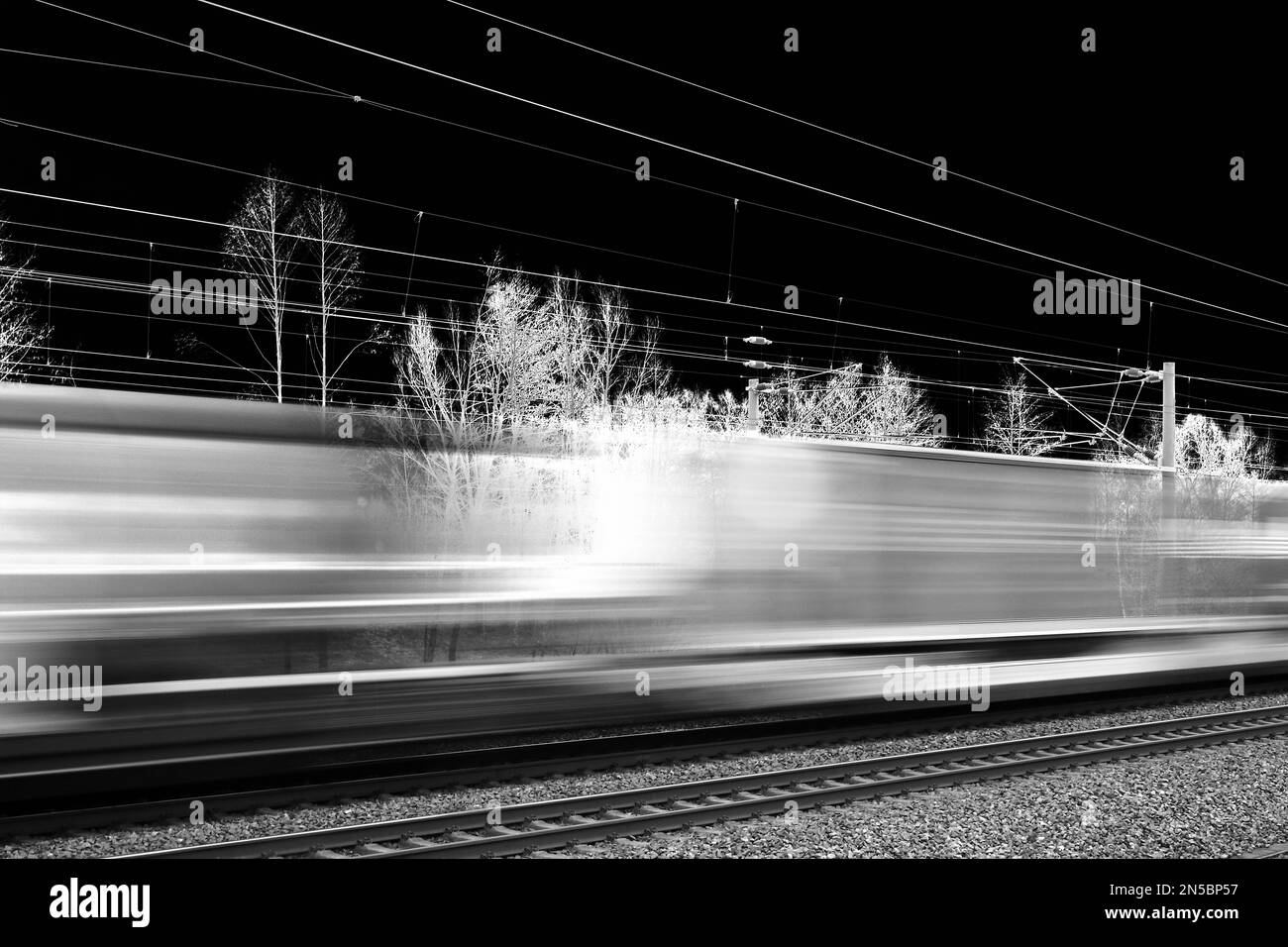 rush pasting express train at night, Germany Stock Photo