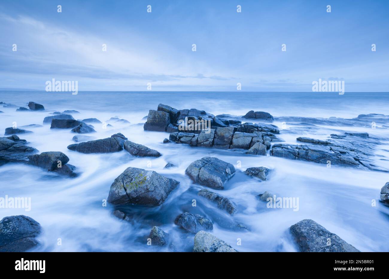 stormy sea at dawn during the blue hour, near Reiff on the west coast, United Kingdom, Scotland, Reiff Stock Photo