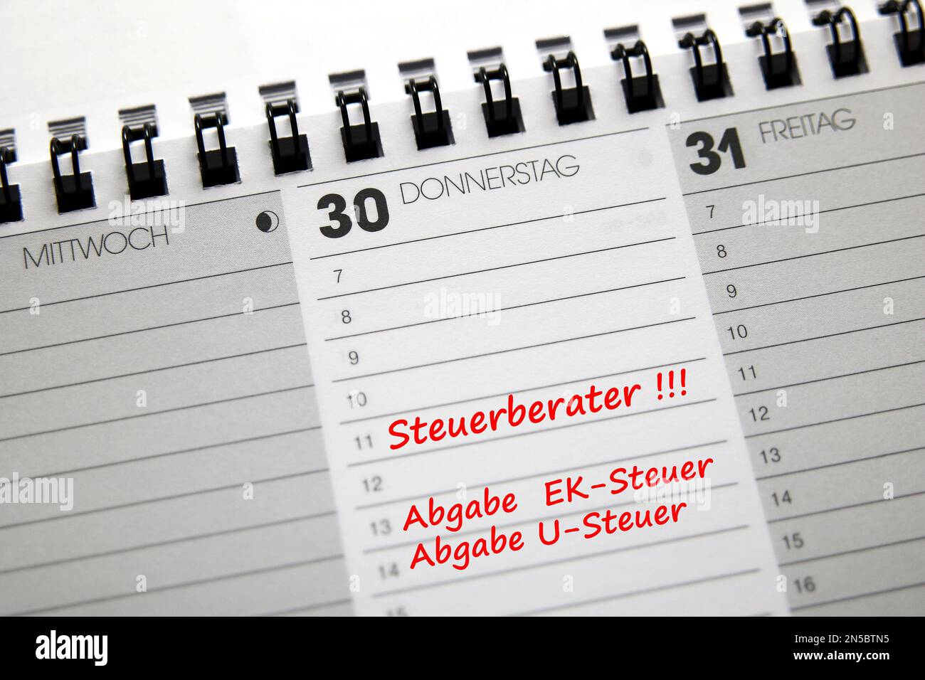 desk calendar in German with entry tax accountant, deadline tax