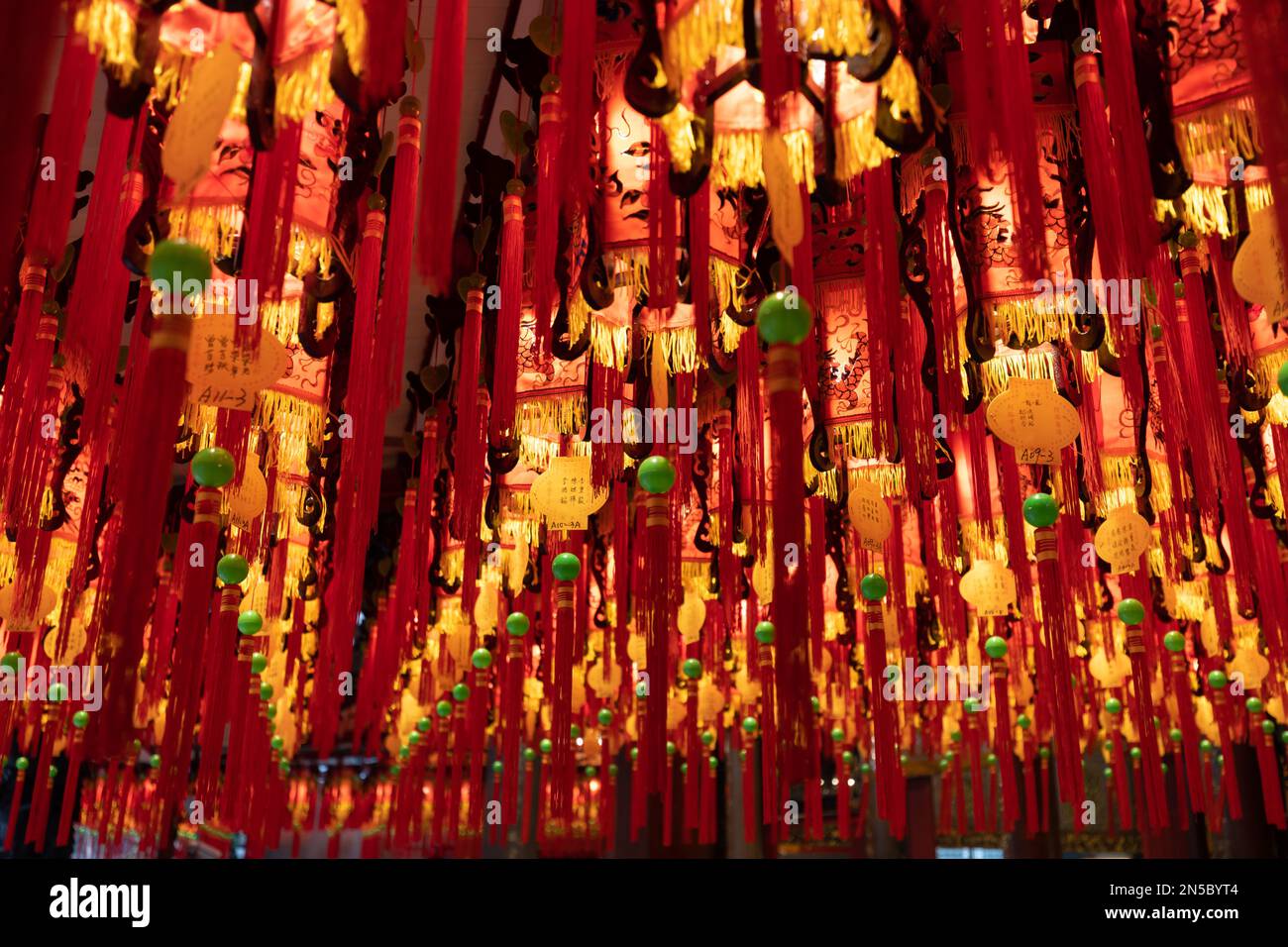 Lanterns with tassels in red and yellow, Taipei Tianhou temple dedicated to Mazu / Matsu, the sea goddess or goddess of seafarers, in Taipei, Taiwan. Stock Photo