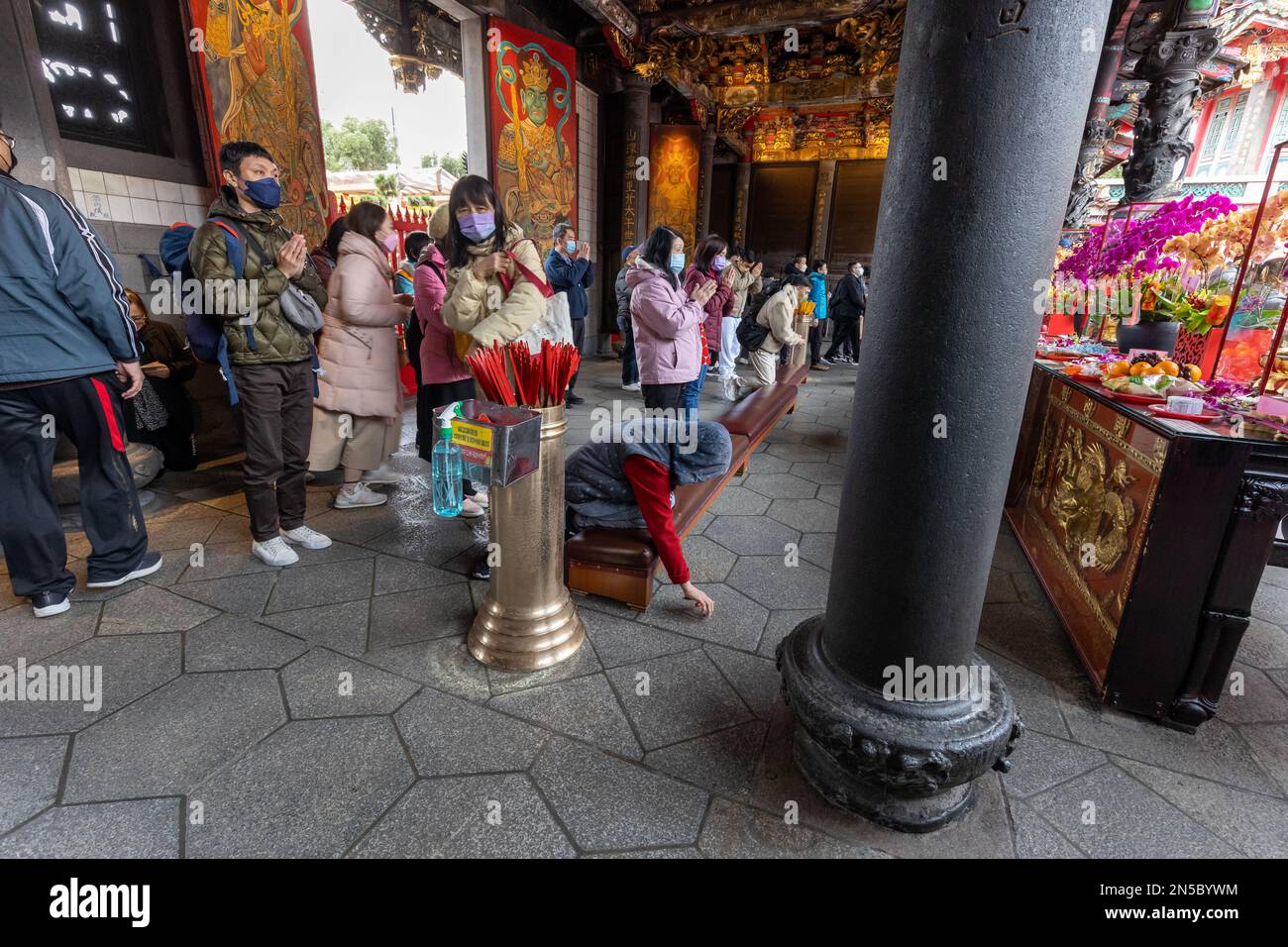 Visitors pray at Longshan Temple in Taipei, Taiwan. Stock Photo