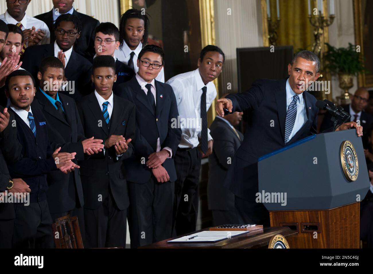 President Barack Obama xxx during an event in the East Room of the White  House to promote his My Brother's Keeper initiative, on Thursday, Feb.  27, 2014, in Washington. Joined at the