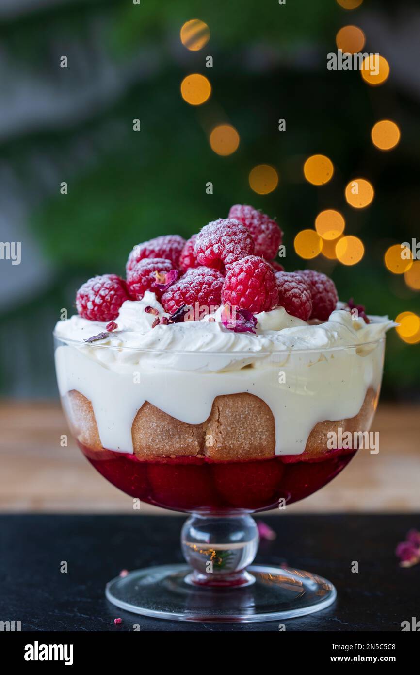 Raspberry trifle with fruit jelly, custard and cream Stock Photo Alamy