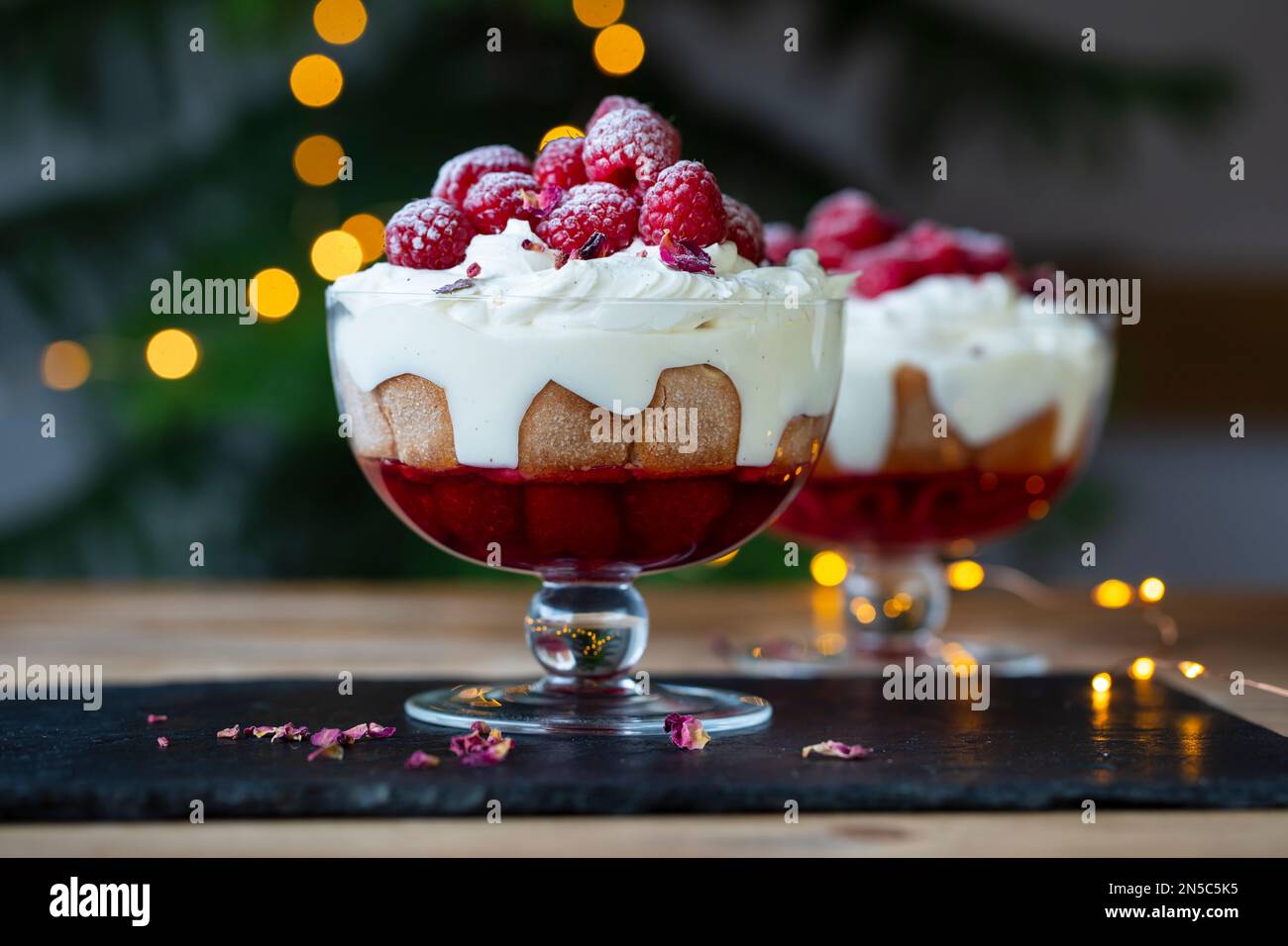 Raspberry trifle with fruit jelly, custard and cream Stock Photo Alamy