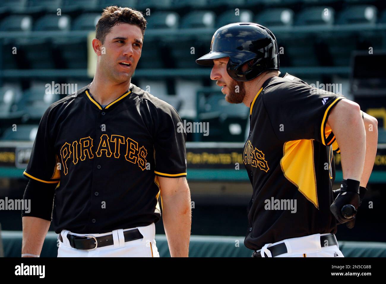Pittsburgh Pirates' Brent Morel, right, talks with Andrew Lambo as he warms up before taking