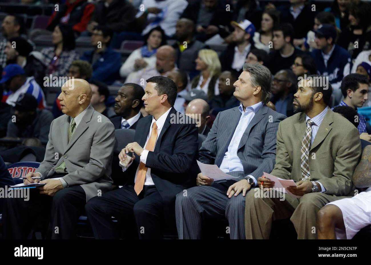 From left, Detroit Pistons assistant coach Henry Bibby, head coach John