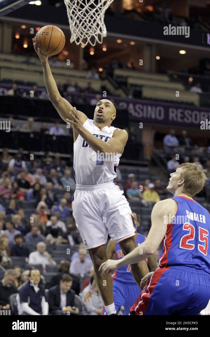 Charlotte Bobcats' Gerald Henderson (9) scores over Detroit Pistons ...