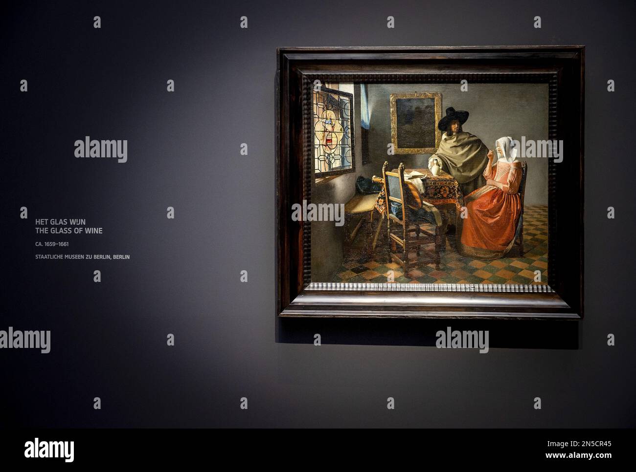 AMSTERDAM - The painting The glass of wine by Johannes Vermeer during the  opening of the Vermeer exhibition in the Rijksmuseum. For the opening,  guests from all over the Netherlands have been