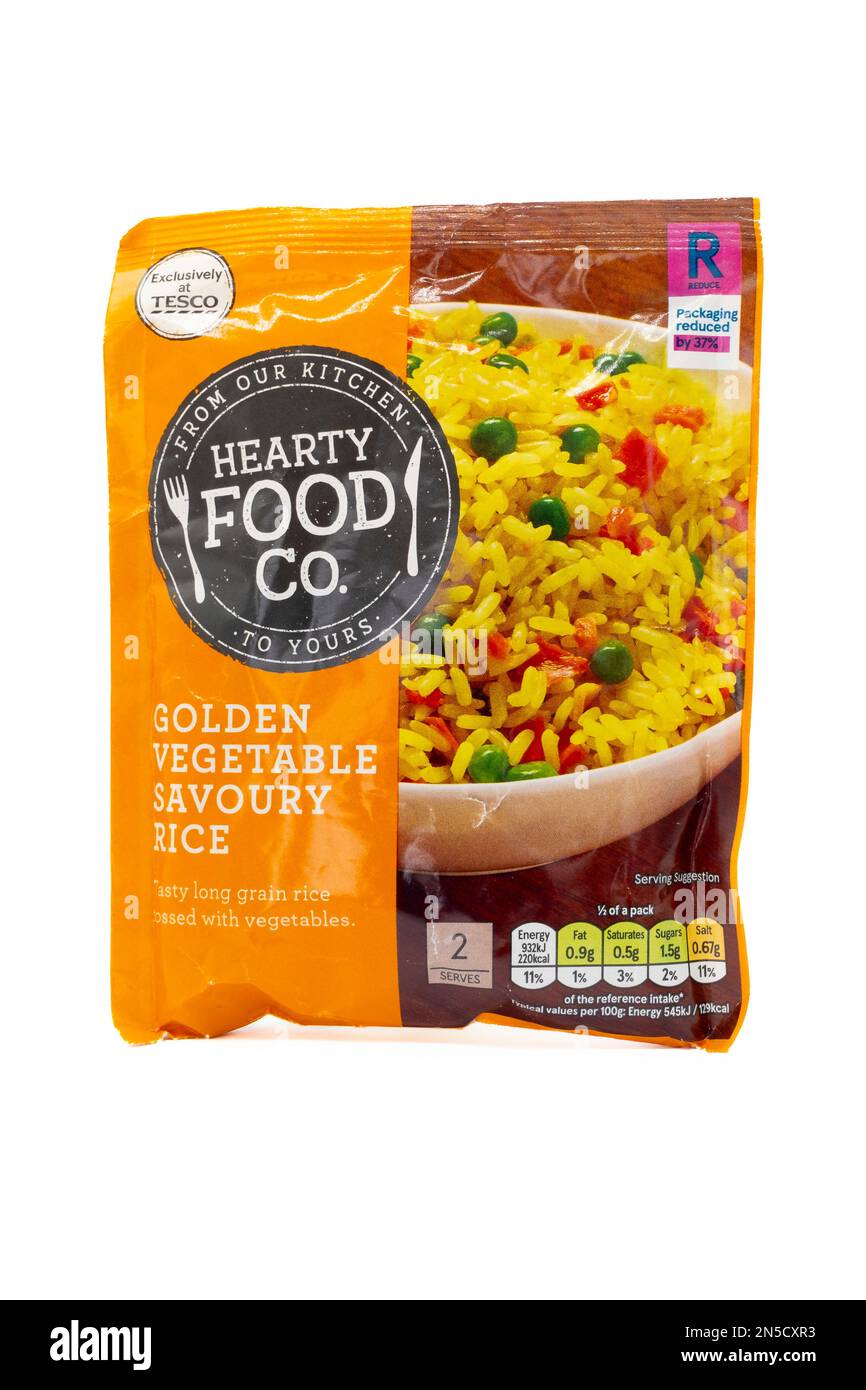 Irvine, Scotland, UK - February  02, 2023: Tesco branded Hearty Food Co golden vegetable savoury rice In packaging displaying graphics and energy icon Stock Photo