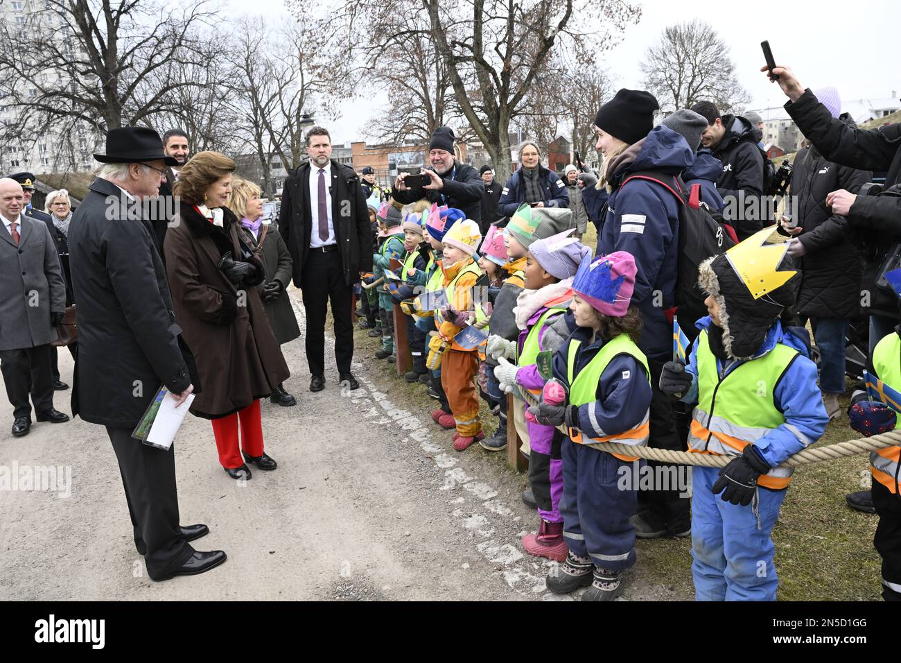 Sweden's King Carl XVI Gustaf and Queen Silvia are greeted by children during their walk to Nykoping Castle during the royal visit to Sodermanland Cou Stock Photo