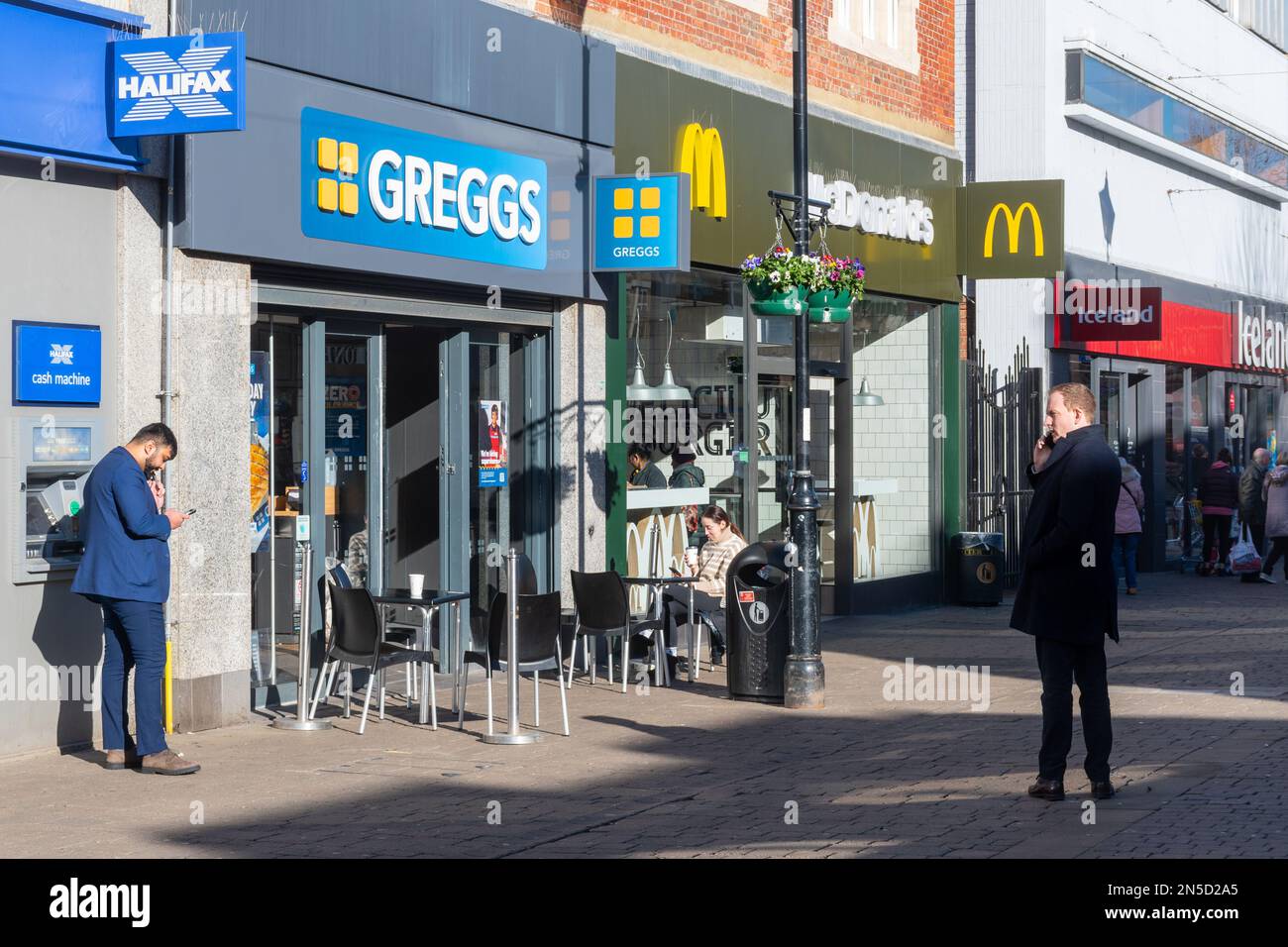 Shops and businesses on the High Street in Staines-upon-Thames town centre, including Greggs and MacDonalds, Surrey, England, UK Stock Photo