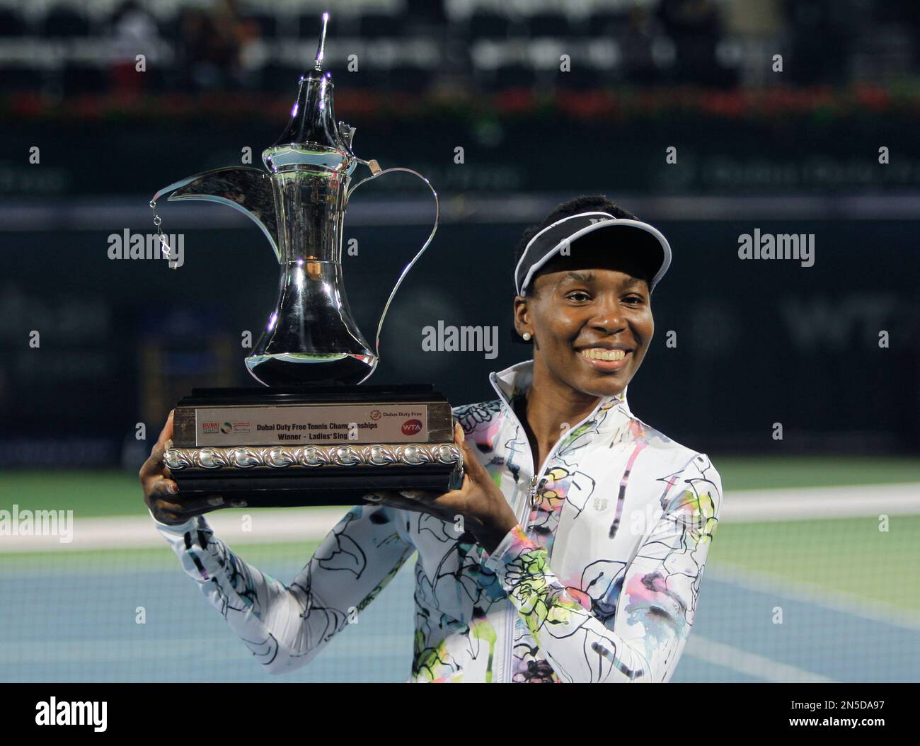 Venus Williams of the U.S. holds the trophy after she beat Alize Cornet of  France during the final match of Dubai Duty Free Tennis Championships in  Dubai, United Arab Emirates, Saturday, Feb.