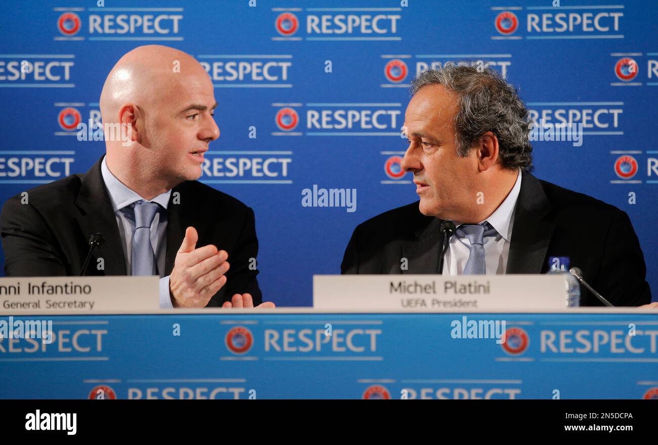 UEFA President Michel Platini, right, speaks with UEFA General