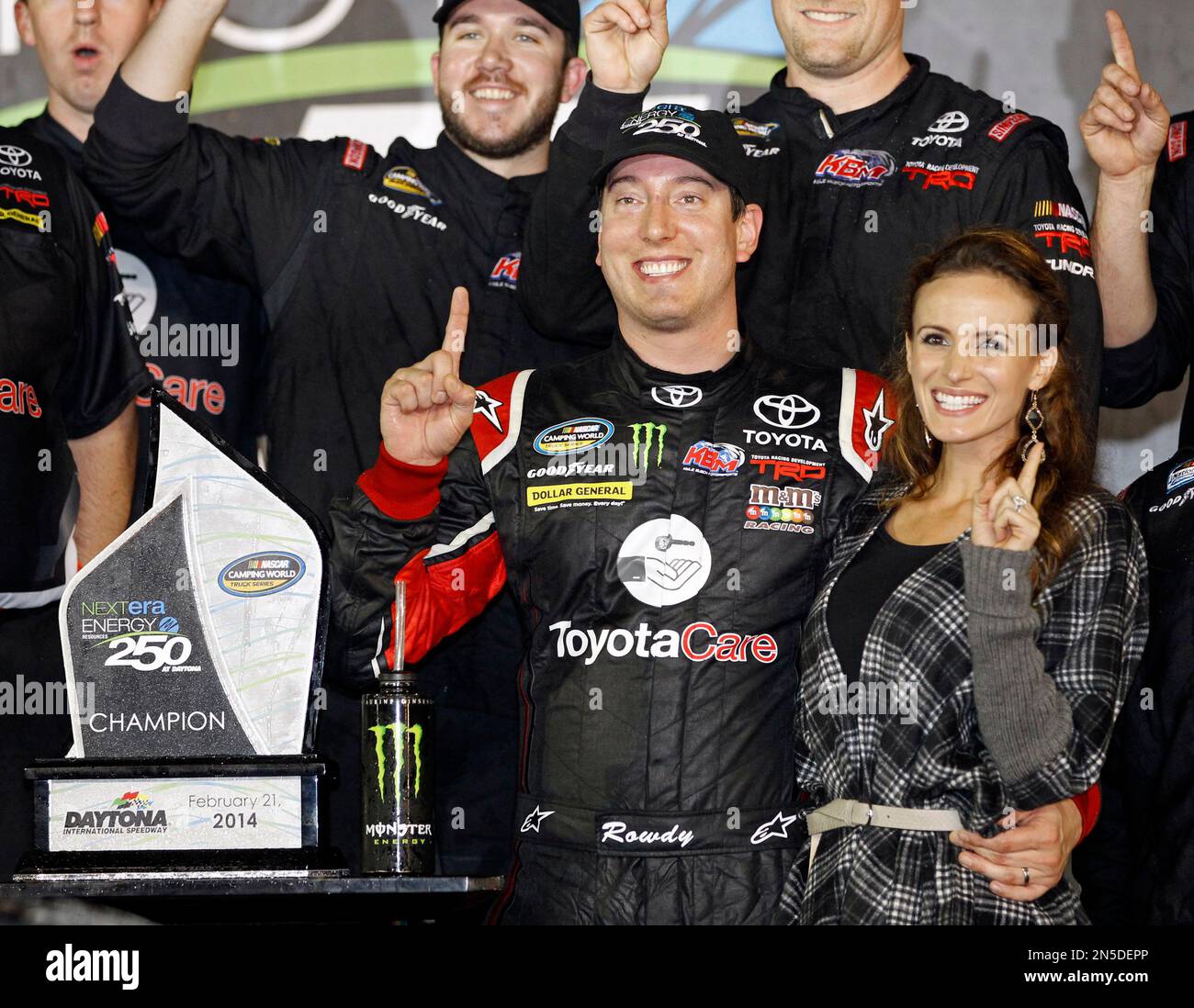 Kyle Busch celebrates in Victory Lane with his wife, Samantha, right