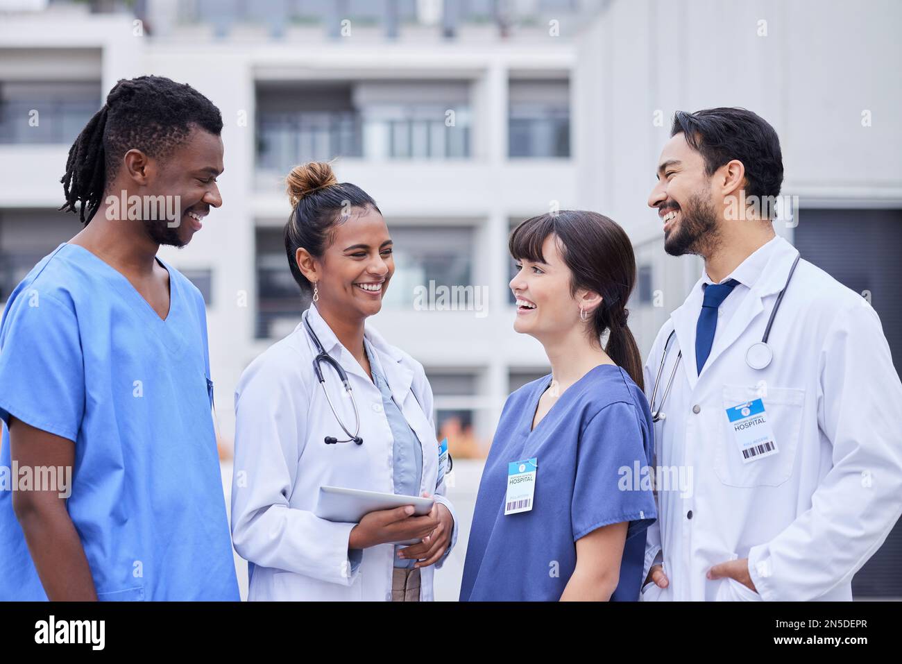 Doctors, happy or team building with tablet outdoor for collaboration