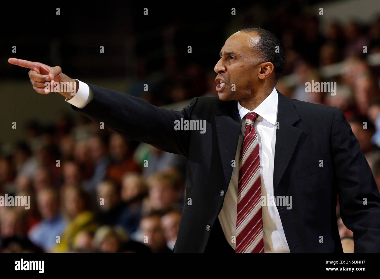Stanford head coach Johnny Dawkins argues a call during the first half