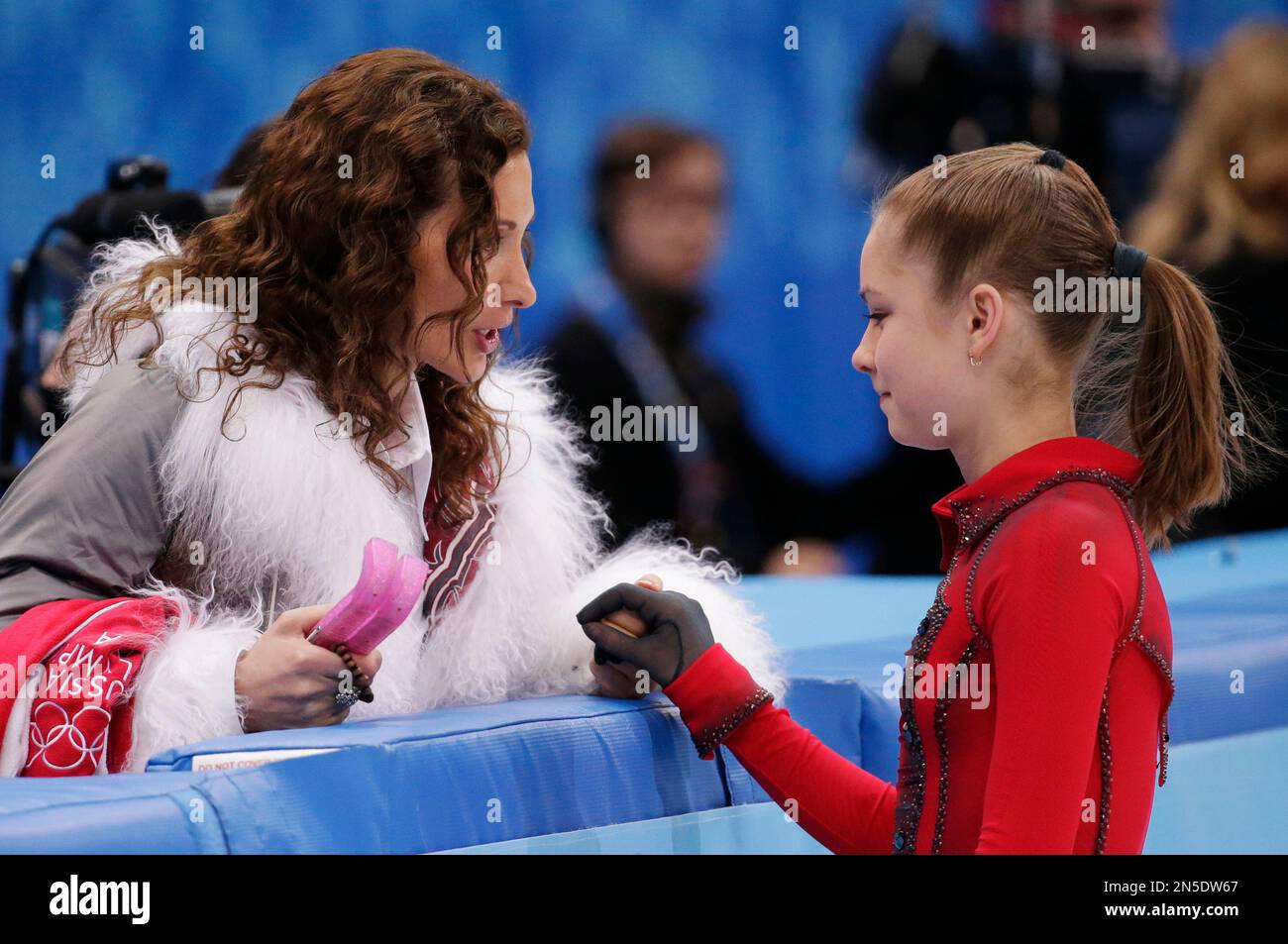 Julia Lipnitskaya of Russia, right, speaks with her coach Eteri Tutberidze  before competing in the women's free skate figure skating finals at the  Iceberg Skating Palace during the 2014 Winter Olympics, Thursday,, image size:1300x953