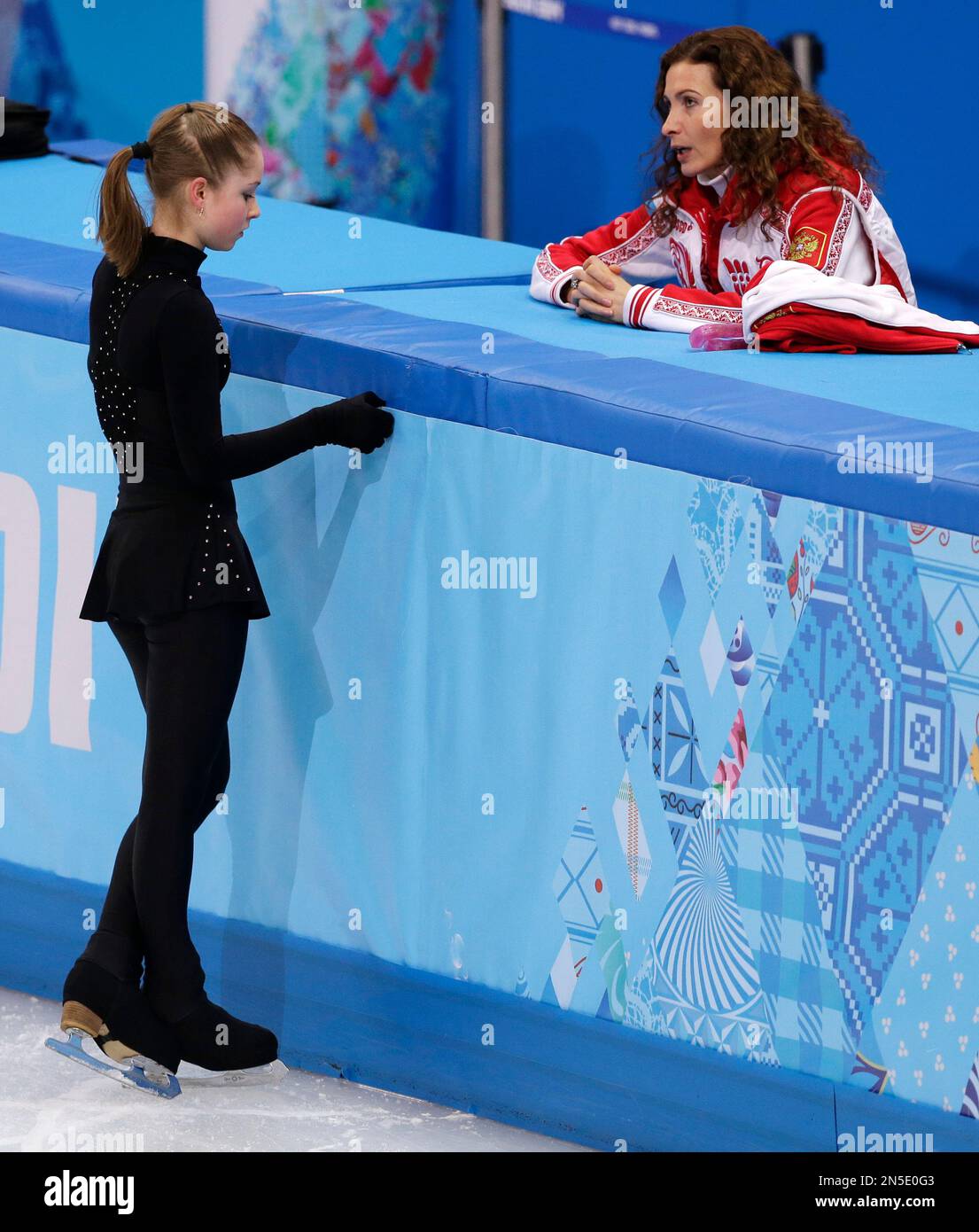 Julia Lipnitskaya of Russia talks with her coach, Eteri Tutberidze, during  a practice session at the Iceberg Skating Palace during the 2014 Winter  Olympics, Thursday, Feb. 20, 2014, in Sochi, Russia. (AP, image size:1105x1390